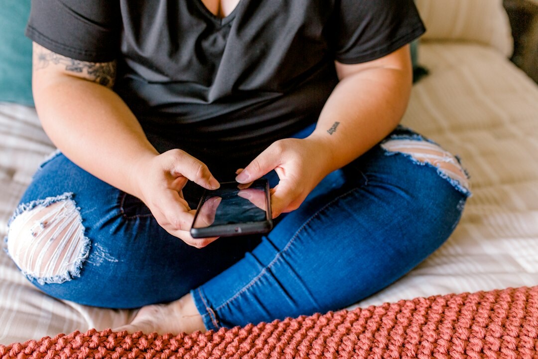 person using smartphone at home