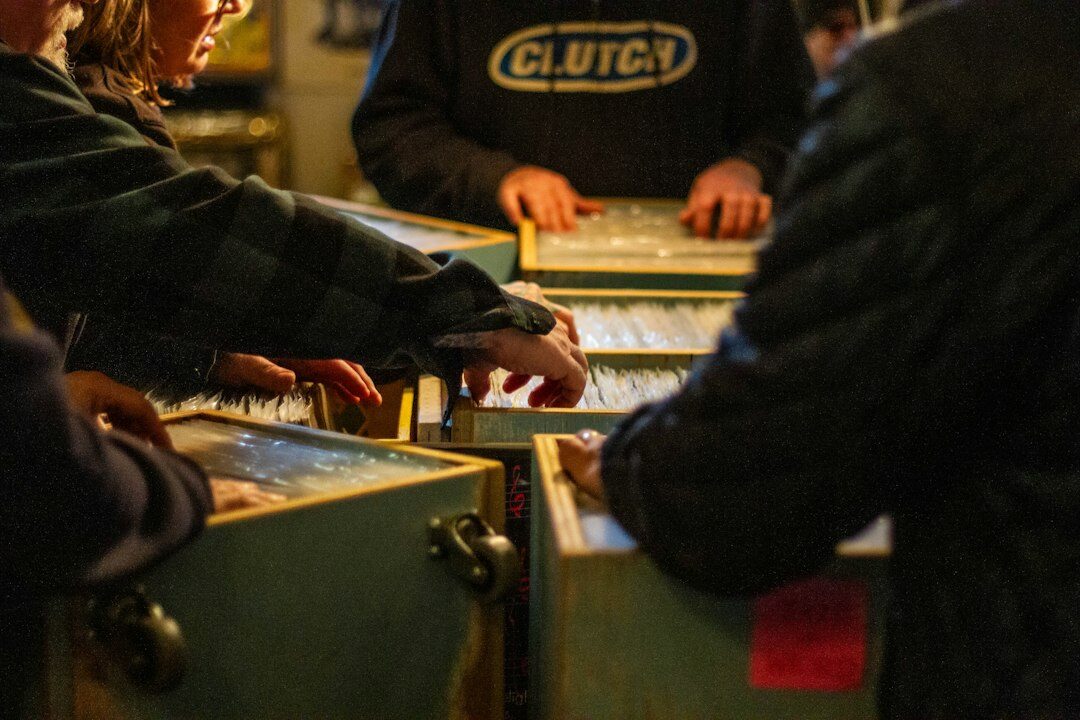 People discussing charts and documents at a desk