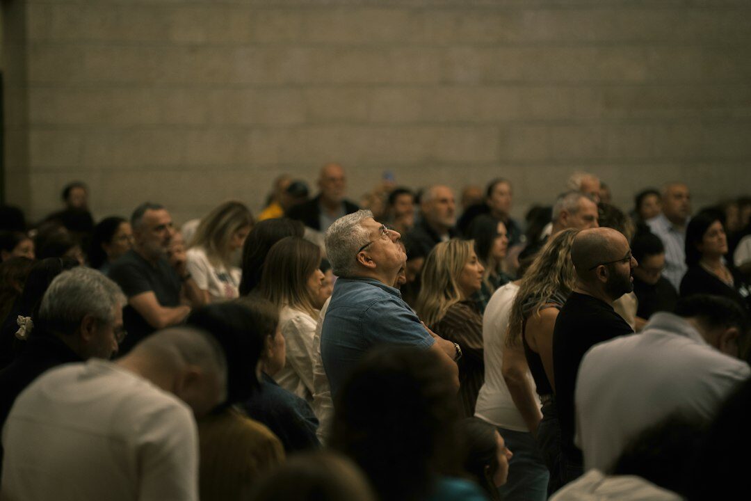 crowd of people with worried expressions